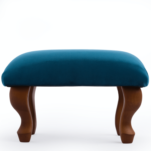 Reposapiés tapizado en azul, un elemento interior elegante y práctico