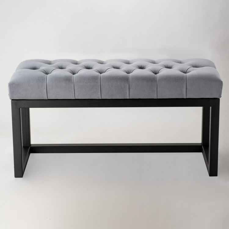 Banco acolchado tipo loft sobre base de metal