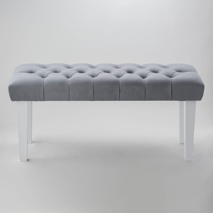 Banco acolchado gris con patas rectas blancas