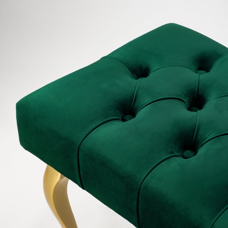 Elegante banco capitoné con patas doradas en color verde botella
